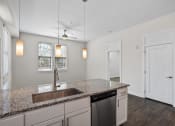 Thumbnail 95 of 95 - a kitchen with a sink and a counter top
