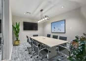Thumbnail 20 of 39 - a conference room with a table and chairs