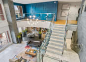 Thumbnail 1 of 39 - a view of the lobby of a building with stairs and a blue wall