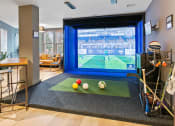 Thumbnail 5 of 39 - a game room with a large screen tv and balls on a rug