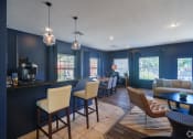 Thumbnail 4 of 25 - a living room and dining room with blue walls and a table and chairs