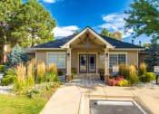Thumbnail 1 of 25 - the front of a house with a driveway and a porch