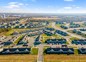 Thumbnail 11 of 11 - A suburban neighborhood with houses and roads.