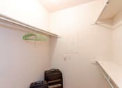 Thumbnail 11 of 18 - Spacious Walk In Closet with Three Hanging Rods