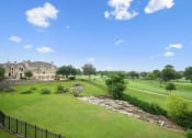 Thumbnail 36 of 36 - a view of a golf course with a house in the background