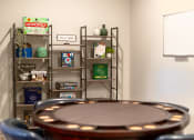 Thumbnail 33 of 48 - a poker table in a room with a game board