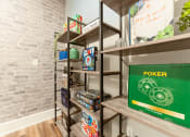 Thumbnail 34 of 48 - a room with shelves and a green poster on the wall