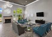 Thumbnail 14 of 37 - a living room with blue couches and chairs and a fireplace