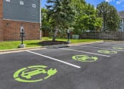 Thumbnail 31 of 37 - a parking lot with symbols of bikes on the ground