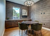 Thumbnail 4 of 40 - a dining room with a round table and chairs