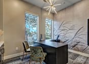 Thumbnail 8 of 40 - a home office with a large window and a desk with chairs