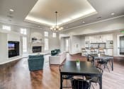 Thumbnail 6 of 32 - Sonoma Clubhouse with large windows, plank flooring, living room furniture and built in flat screen tv, large common area kitchen with seating