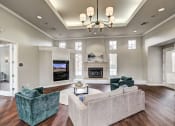 Thumbnail 4 of 32 - Sonoma Clubhouse with large windows, plank flooring, living room furniture and built in flat screen tv