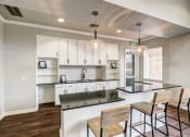Thumbnail 5 of 32 - Large common area kitchen with seating