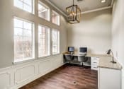 Thumbnail 7 of 32 - Business center with two computers, large windows and lots of desk space