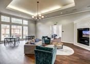 Thumbnail 3 of 32 - Sonoma Resort at Saddle Rock - Clubhouse With Large Windows, Plank Flooring, Living Room Furniture, and Built-In Flat Screen TV