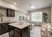 Thumbnail 6 of 25 - A kitchen with dark wood cabinets and a white countertop.