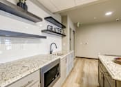 Thumbnail 12 of 25 - A kitchen with a granite countertop and a sign that says "GRATEFUL".