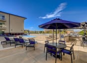 Thumbnail 33 of 33 - our apartments have a large patio with tables and chairs and a pool