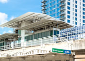 Thumbnail 43 of 43 - A train station with a green sign that says
