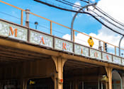 Thumbnail 42 of 43 - A train station with a sign that reads