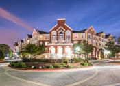 Thumbnail 36 of 39 - an exterior view of a building at night with a street
