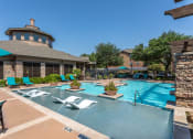 Thumbnail 3 of 48 - the preserve at ballantyne commons pool with lounge chairs and a resort style pool