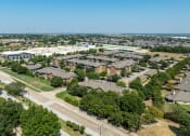 Thumbnail 48 of 48 - an aerial view of a suburban neighborhood with houses and trees