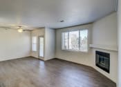 Thumbnail 35 of 40 - an empty living room with a fireplace