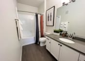 Thumbnail 27 of 40 - a bathroom with a toilet sink and shower