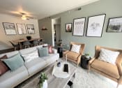 Thumbnail 22 of 40 - a living room filled with furniture and a large window