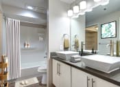 Thumbnail 5 of 34 - Two-Bedroom Apartments in Seattle, WA - Union Bay - Bathroom with Double Bowl Sinks, Separate Toilet, and Shower