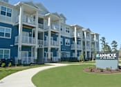 Thumbnail 1 of 65 - A blue and white apartment complex named Annexe at the Reserve.
