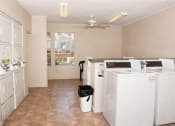 Thumbnail 16 of 18 - Laundry Care Center with Washers and Dryers