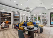 Thumbnail 28 of 47 - resident clubhouse with seating and kitchen