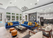 Thumbnail 26 of 47 - resident clubhouse with seating and kitchen
