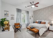 Thumbnail 16 of 47 - a bedroom with a large bed and a geometric wall paper on the ceiling