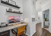 Thumbnail 9 of 47 - a home office with a desk with a computer on it and a hallway with a