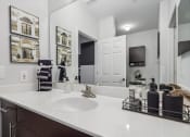Thumbnail 15 of 47 - a large bathroom with a large sink and mirrors
