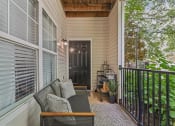 Thumbnail 22 of 47 - covered patio with a chair and a table