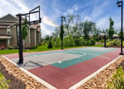 Thumbnail 22 of 48 - Riverstone - BasketballCourt Surrounded byLush Greenery