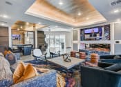 Thumbnail 11 of 37 - Game room and lounge with TV and gas fireplace