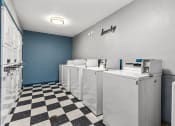 Thumbnail 12 of 19 - Laundry room with washers and dryers