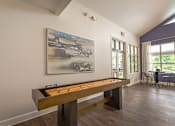 Thumbnail 20 of 26 - a game room with a pool table and a painting on the wall