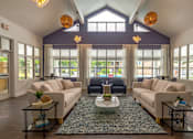 Thumbnail 18 of 26 - a living room with two couches and a coffee table