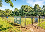 Thumbnail 15 of 26 - A sign that says Paw Park is on a fence.