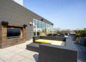 Thumbnail 6 of 31 - the patio has a fireplace and outdoor furniture