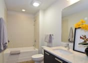 Thumbnail 23 of 31 - a bathroom with a sink toilet and a bath tub