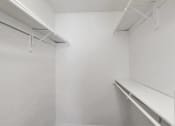 Thumbnail 77 of 77 - an empty room with white walls and a white shelf