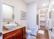 Thumbnail 16 of 19 - a bathroom with a sink and a toilet and a shower